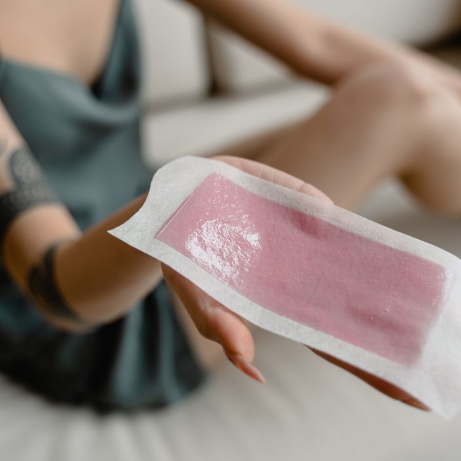 Pink wax strip ready to apply